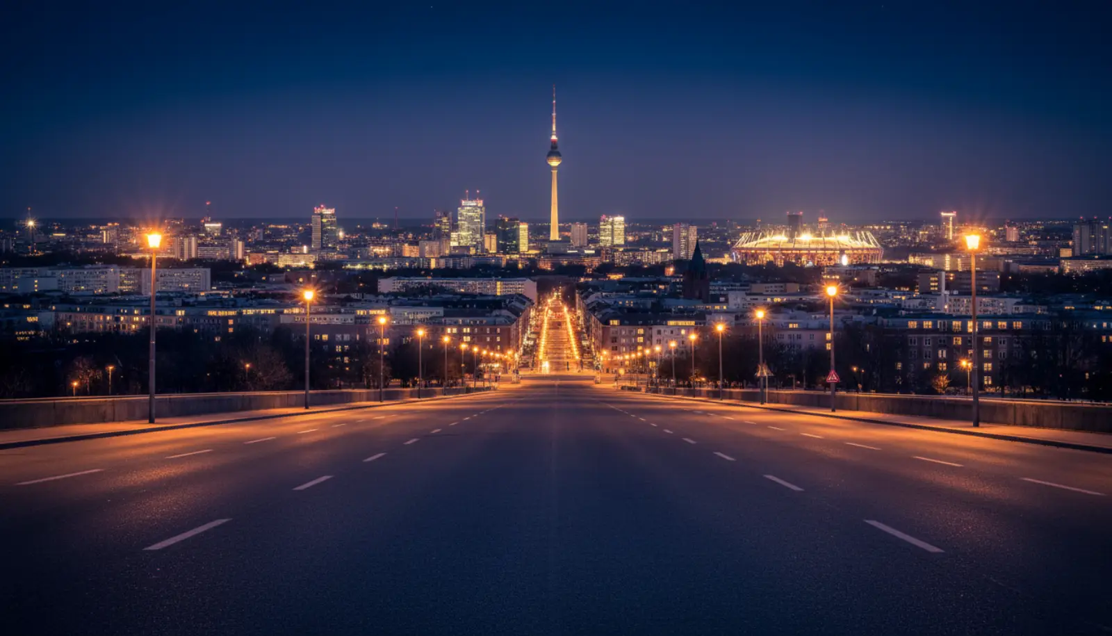 Dortmunder Skyline bei Nacht mit dem Florianturm und den Lichtern des Stadions